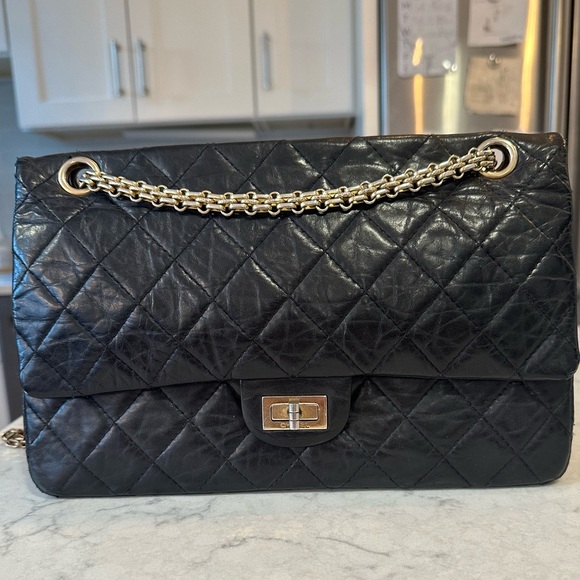 CHANEL Handbags - CHANEL 2.55 Black Quilted Lambskin with Gold Bijoux Hardware